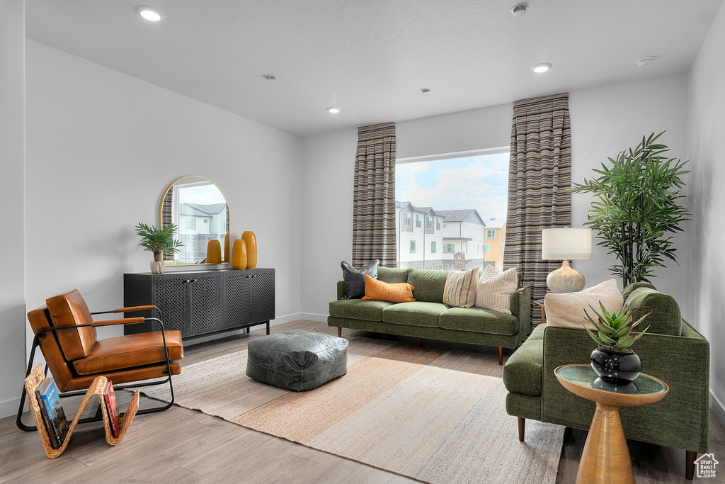 Living area featuring recessed lighting, baseboards, and wood finished floors
