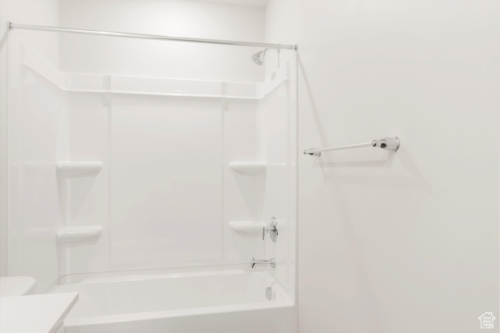 Full bathroom with vanity, shower / tub combination, and toilet