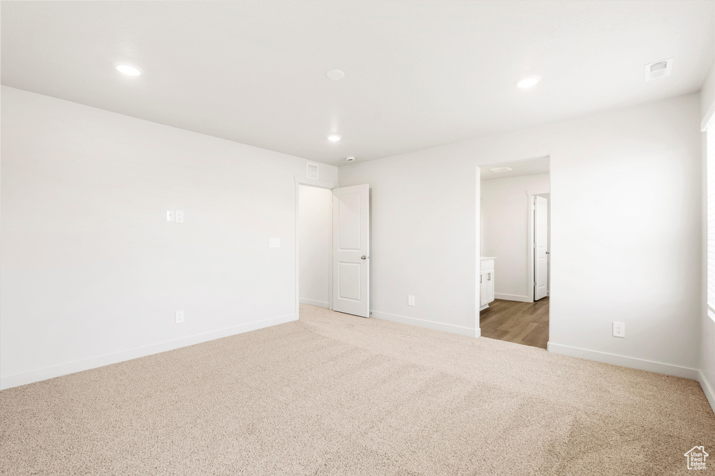 Unfurnished bedroom featuring carpet, recessed lighting, and baseboards