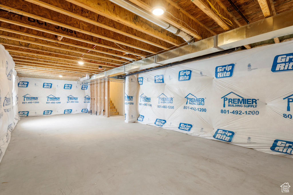 Unfinished basement featuring stairway