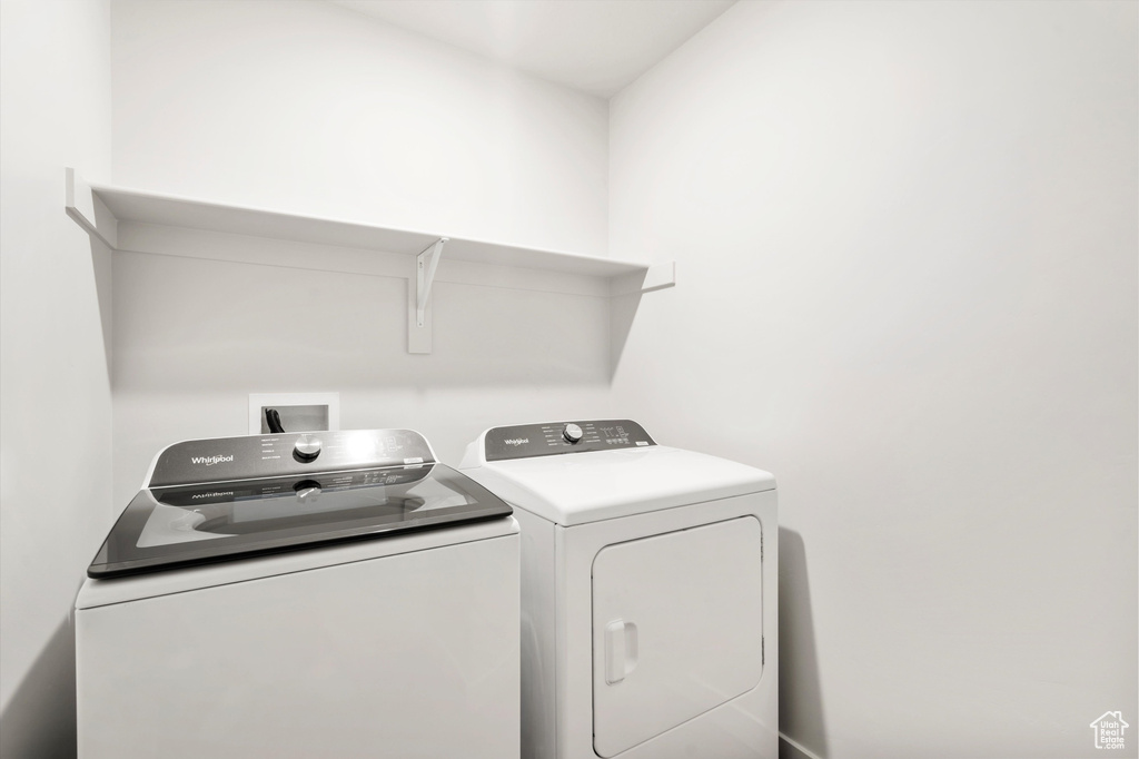 Laundry room featuring washer and clothes dryer