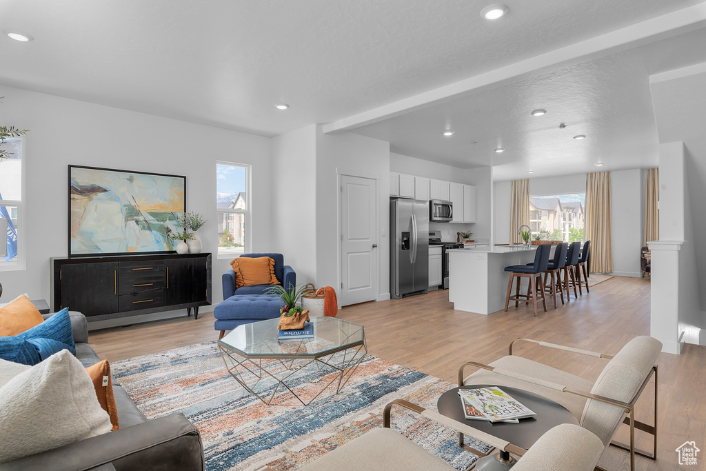 Living room featuring recessed lighting and light wood-type flooring