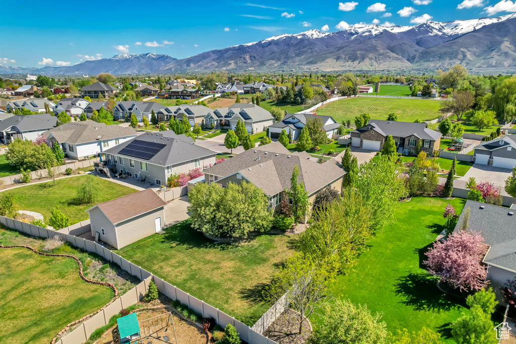Birds eye view of property with a residential view and a mountain view