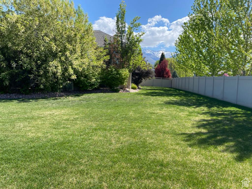 View of yard with a fenced backyard