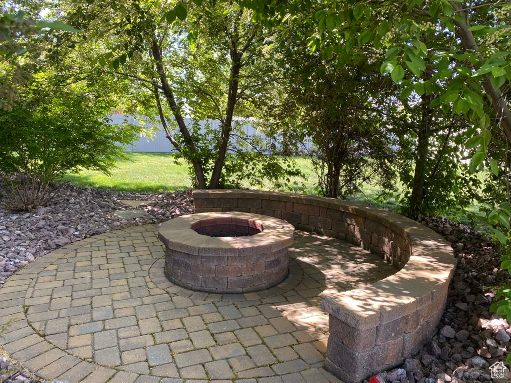 View of patio featuring an outdoor fire pit