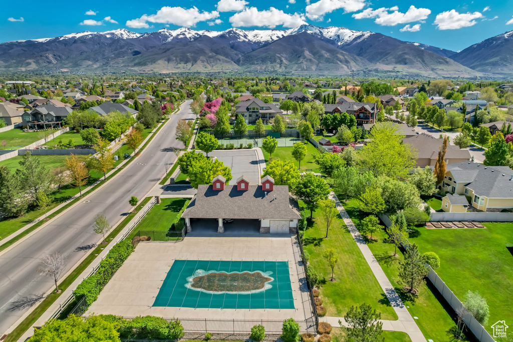 Drone / aerial view with a residential view and a mountain view