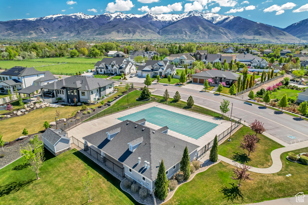 Birds eye view of property with a mountain view and a residential view