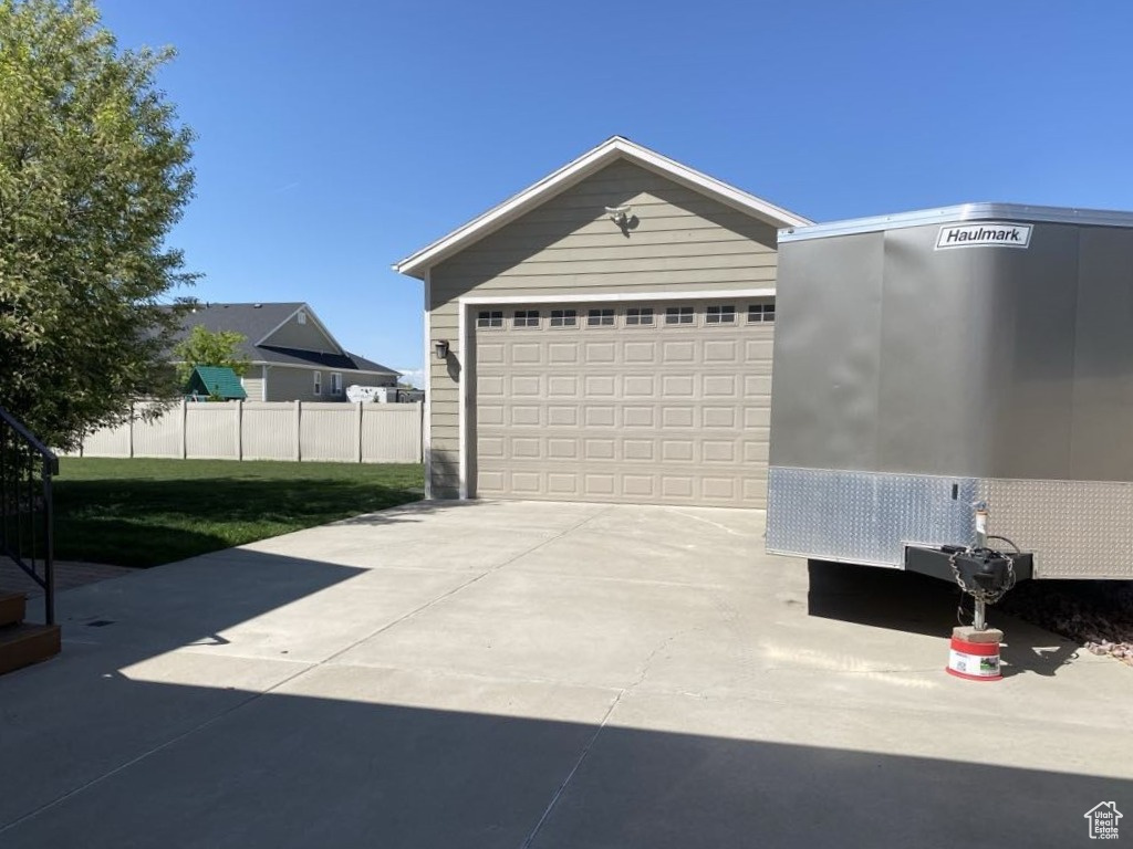 Garage featuring fence