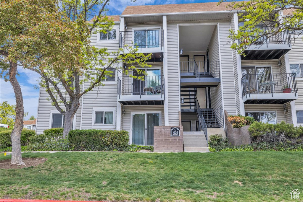 View of property featuring stairs