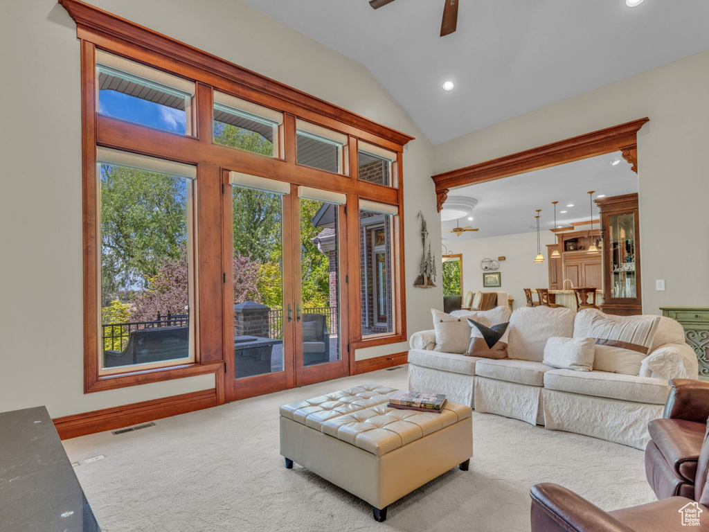 Carpeted living room with visible vents, recessed lighting, french doors, a ceiling fan, and vaulted ceiling