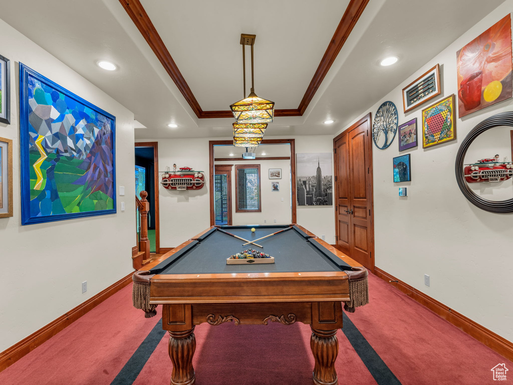 Game room featuring recessed lighting, a tray ceiling, ornamental molding, and carpet