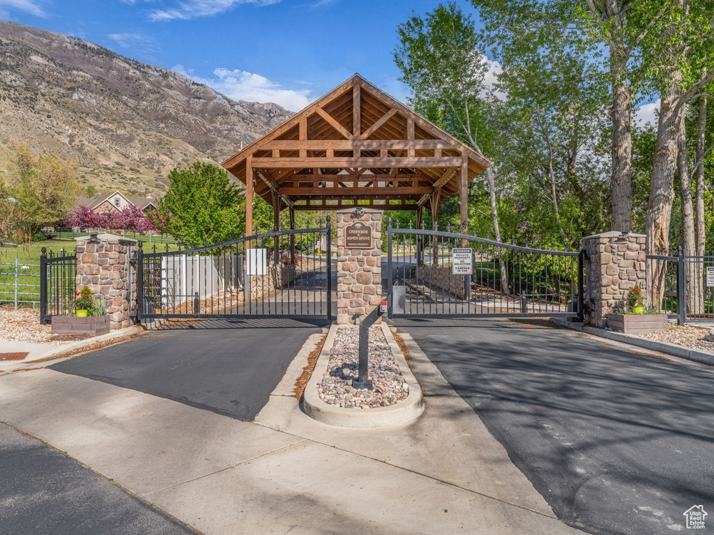 View of gate with a mountain view and fence
