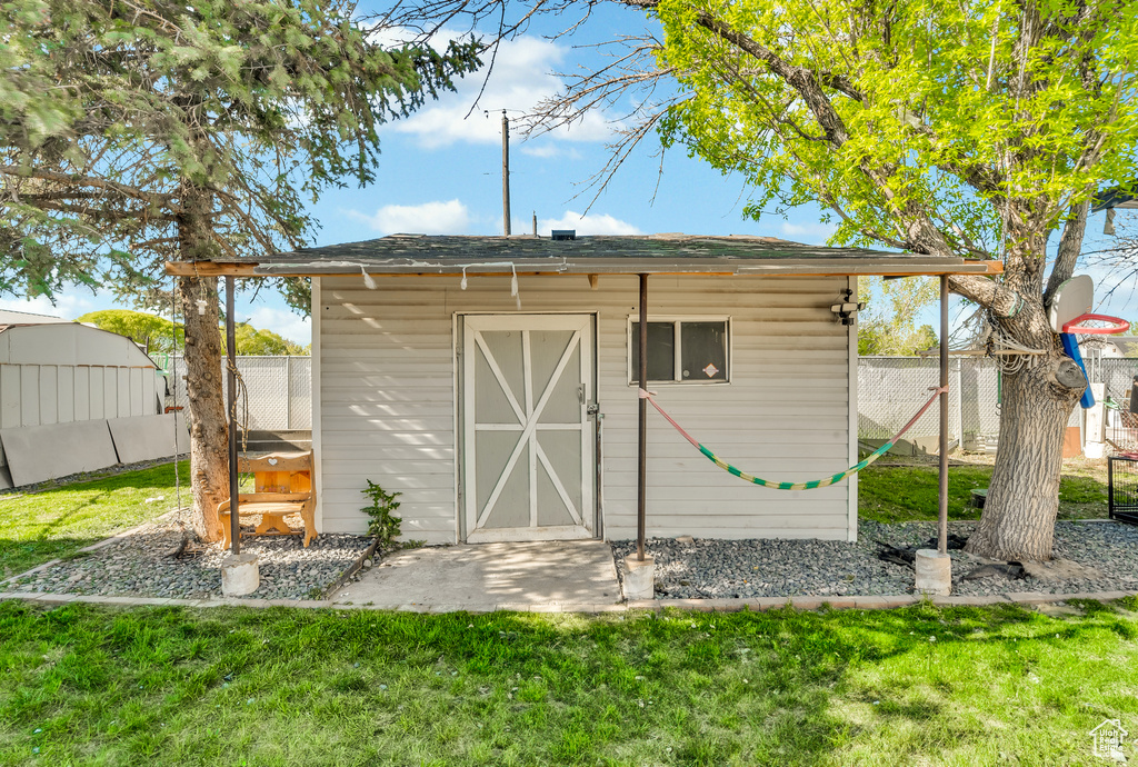 View of shed with fence