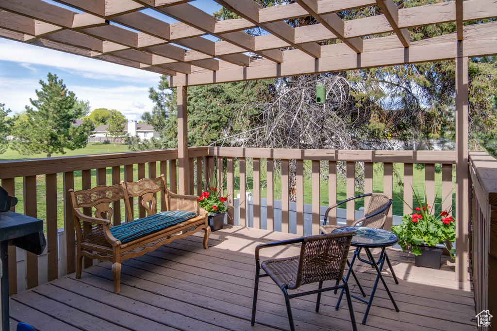 Deck featuring a pergola