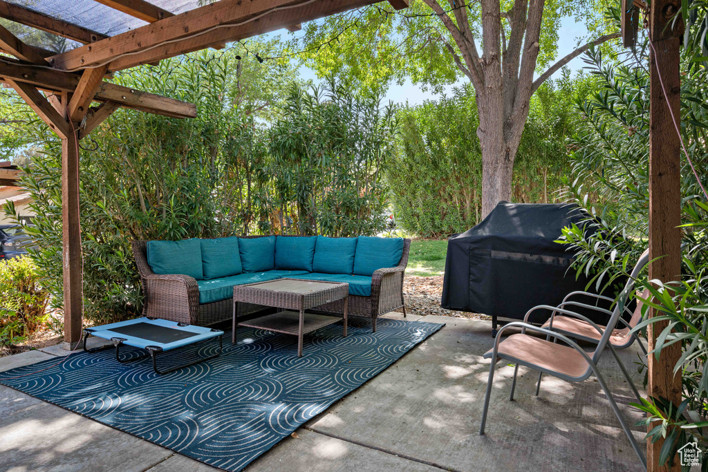 View of patio / terrace featuring a pergola, an outdoor hangout area, and a grill