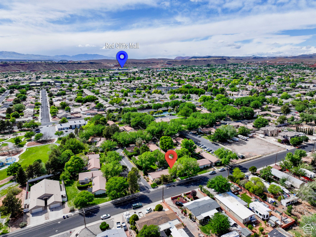 Birds eye view of property with a mountain view and a residential view