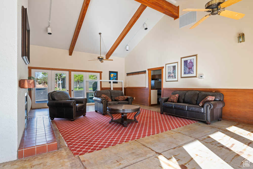 Living room featuring ceiling fan, visible vents, beam ceiling, track lighting, and high vaulted ceiling