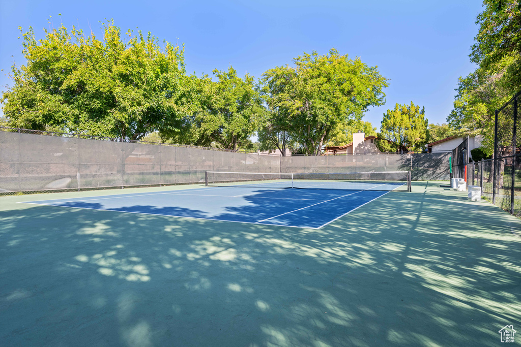 View of tennis court with fence