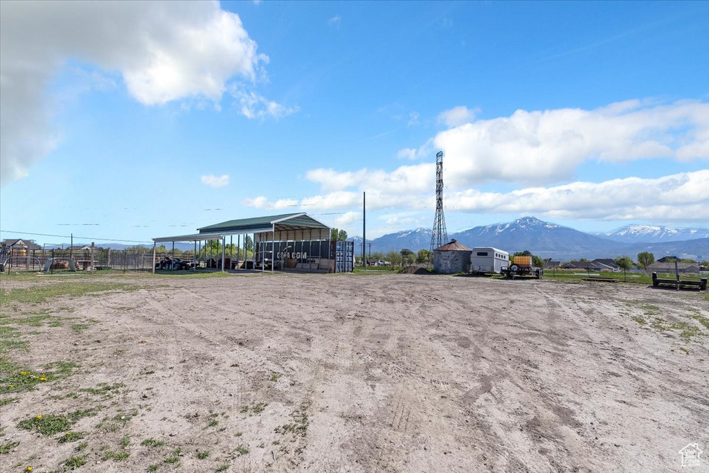 Exterior space with a detached carport and a mountain view