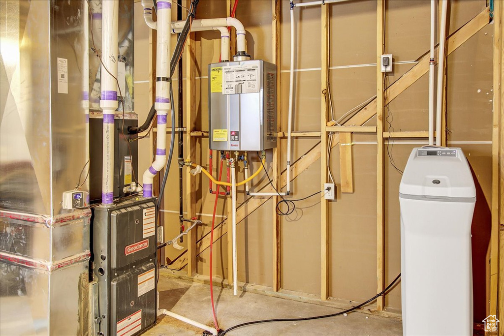 Utility room with tankless water heater and heating unit