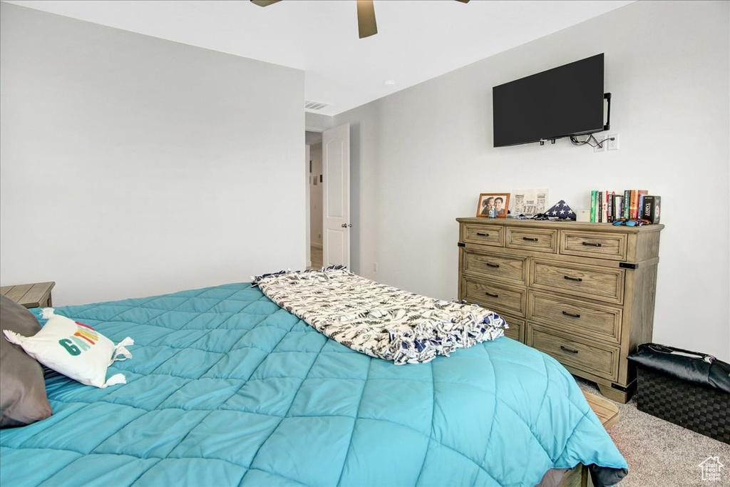 Bedroom with ceiling fan and visible vents