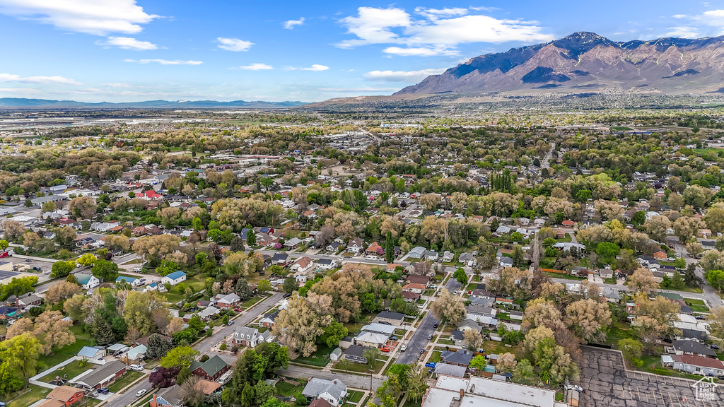 Birds eye view of property with a residential view and a mountain view