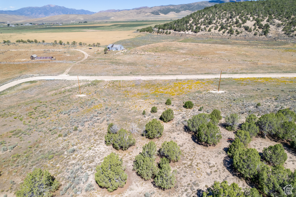 Birds eye view of property featuring a mountain view and a rural view