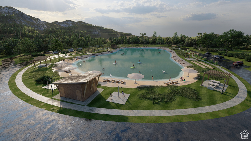 View of pool with a mountain view
