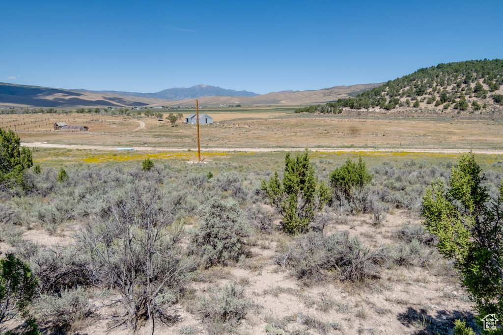 Property view of mountains with a rural view