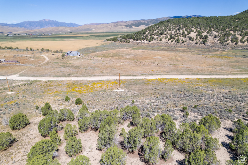 Property view of mountains with a rural view