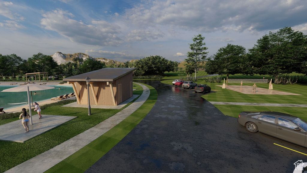 View of home's community featuring a swimming pool and a yard