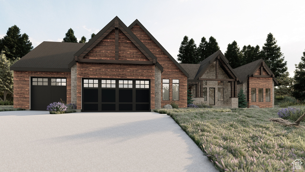 View of front of property with an attached garage and concrete driveway