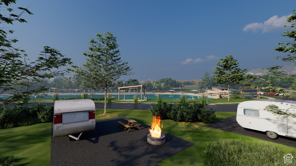View of yard with an outdoor fire pit
