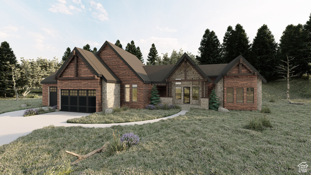 View of front facade with a garage, a front yard, stone siding, and concrete driveway