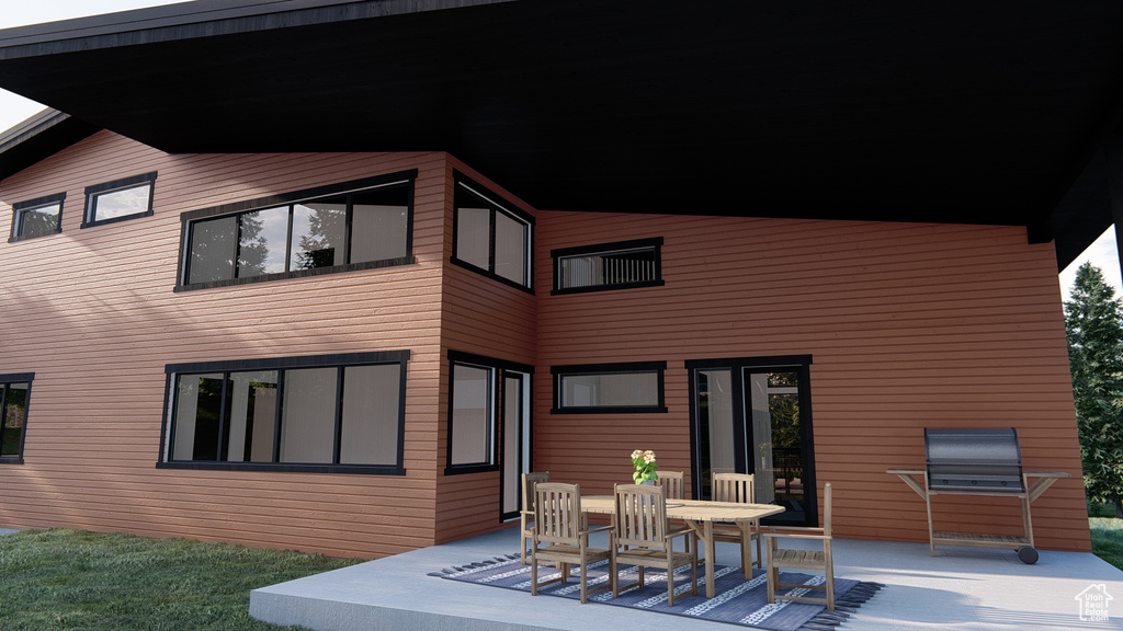 Rear view of property with a patio area
