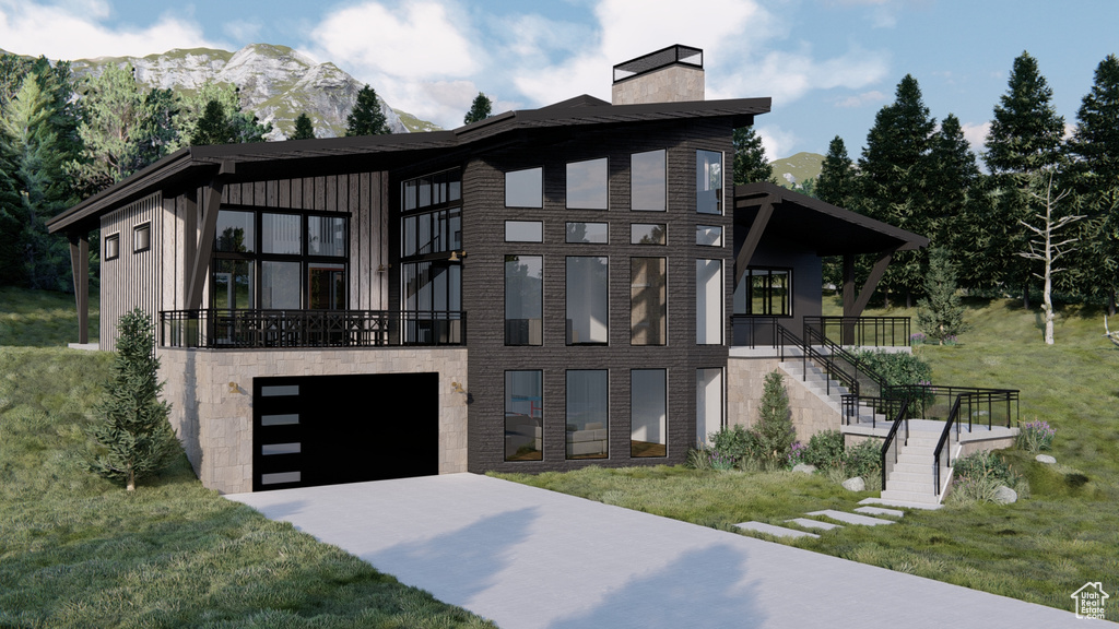Contemporary home with stairs, a front yard, a mountain view, a chimney, and driveway