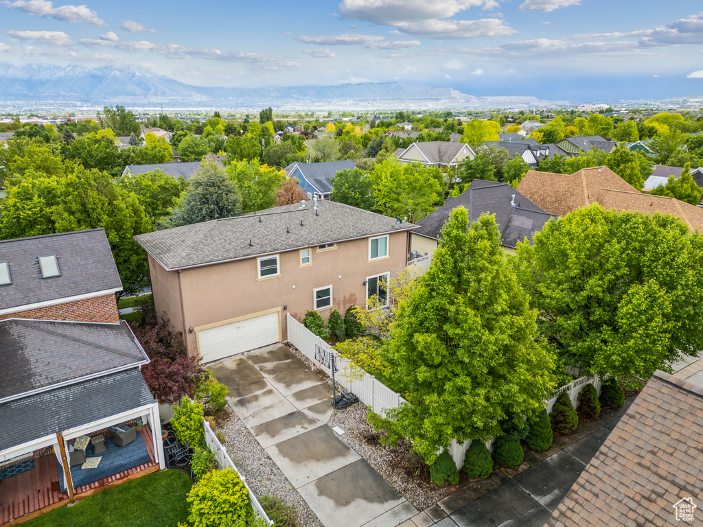 Aerial view of residential area featuring mountains