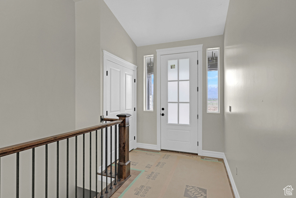 Foyer entrance featuring baseboards