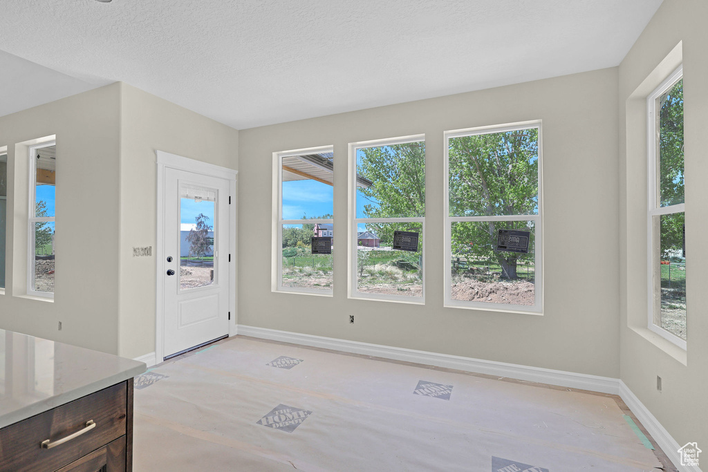 Foyer entrance featuring baseboards