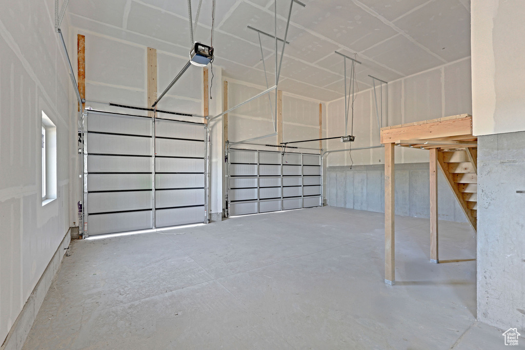 Garage featuring a garage door opener