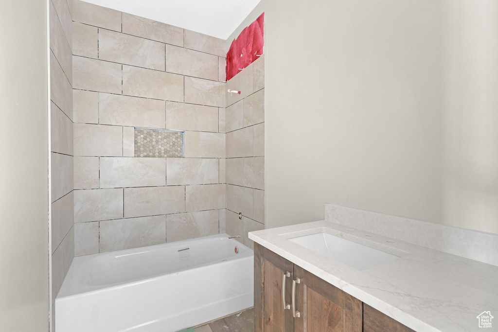 Bathroom featuring shower / bathtub combination and vanity