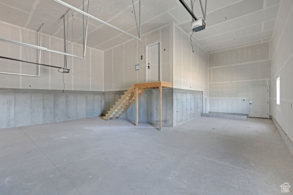 Garage featuring a garage door opener