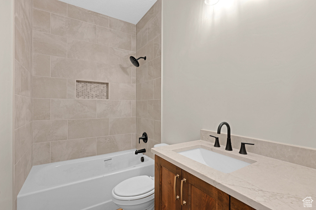 Full bathroom featuring vanity and shower / tub combination