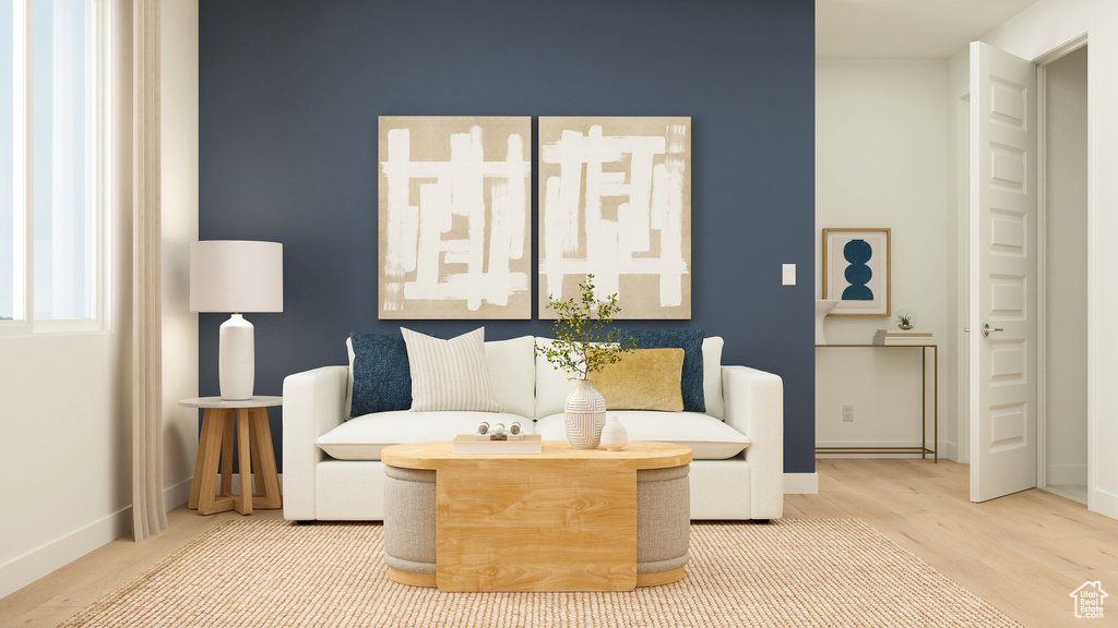 Living area featuring baseboards and wood finished floors