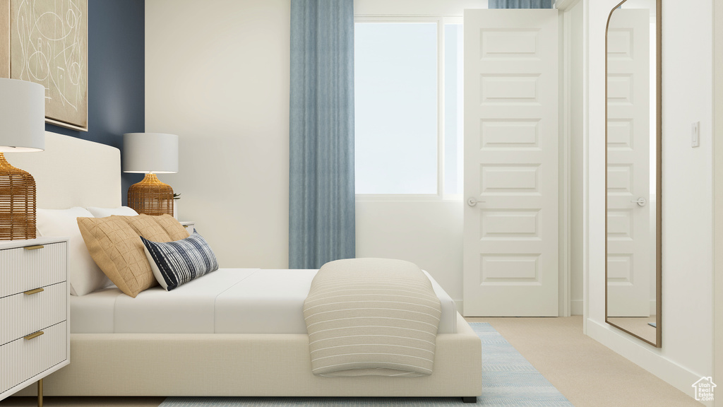 Bedroom with light carpet