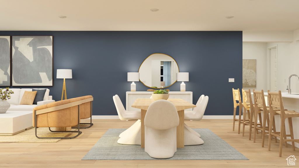 Dining space with baseboards and wood finished floors