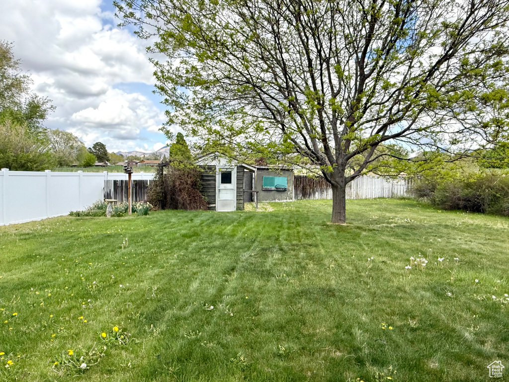 View of yard with a fenced backyard