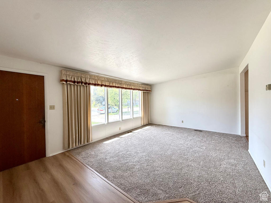 Interior space featuring visible vents and wood finished floors