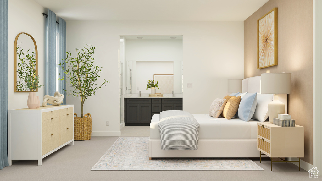 Bedroom featuring baseboards and ensuite bathroom