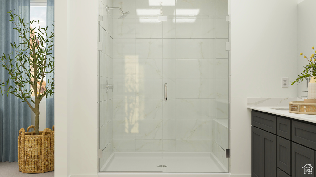 Bathroom featuring vanity and a stall shower